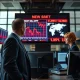 Trader monitors stock market selloff and Middle East conflict news on March 8, 2026.