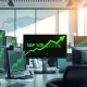 Stock market trading floor showing green upward trends after President Trump's Iran war comments