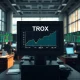 TROX stock ticker showing price crossing analyst target on trading terminal in financial market setting.