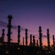 Aerial view of an oil refinery in California under twilight sky.
