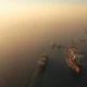 Aerial view of the Strait of Hormuz, a critical global oil shipping lane.