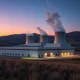 Modern small modular nuclear reactor facility in Tennessee landscape representing TVA's 6-gigawatt program with NuScale Power