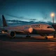 A United Airlines plane parked at a gate as flight schedules are reduced.
