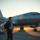 United Airlines enforces new mandatory headphone policy for passengers at Chicago O'Hare airport.