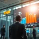 Analyst monitoring unusual options trading activity for FIGR, ZS, and OWL stocks on trading floor.