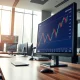 USD/CAD currency pair analysis on trading desk monitor ahead of US Non-Farm Payrolls data release.