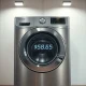 Whirlpool washing machine with stock ticker WHR and share price display, representing insider buying opportunity.