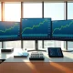 Financial trading desk showing XLSR ETF and holdings Disney, Alphabet, Apple stock analysis with upward trends