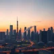 A city skyline in China with industrial infrastructure, representing economic and energy pressures.