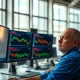 A trader monitors commodity futures prices on a financial trading floor.