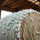 A bale of cotton in a warehouse, representing commodity futures trading.