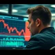 A trader monitors a screen showing the EUR/USD currency pair falling below 1.1800.