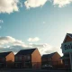 A UK housing development with a sold sign, illustrating the Help to Buy scheme.