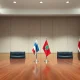 A formal meeting table with Israeli and Lebanese flags, symbolizing upcoming direct talks.