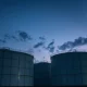 Industrial oil storage tanks at a Japanese strategic petroleum reserve facility.