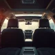 A Lucid Gravity SUV in a showroom, highlighting the vehicle's interior and second-row seats.