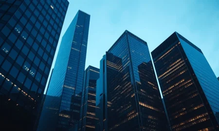 Financial district skyline representing the wave of asset manager consolidation and mergers.
