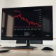 A stock chart showing a decline for Pagaya Technologies (PGY) on a trading desk monitor.