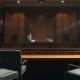 An empty U.S. Senate hearing room, symbolizing an inquiry into airline merger reports.