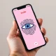 Smartphone showing Tinder app with an eye scan verification graphic overlay.