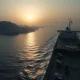 Oil tanker transiting the narrow Strait of Hormuz, a key global oil chokepoint.