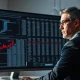 Financial analyst reviewing data on private capital fund fees and adviser compensation.