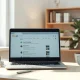 Laptop showing search engine results with icons of alternative search engines on a desk in a bright home office