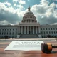 A gavel and the CLARITY Act document on a table in front of the US Capitol building.