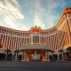 Caesars Palace Las Vegas entrance at sunset, representing the target of a major acquisition bid.