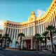 Caesars Palace hotel-casino on the Las Vegas Strip at sunset, representing a potential acquisition target.