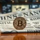 Bitcoin coin on financial newspaper with inflation headline, representing market reaction to CPI data