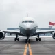 Boeing 787 Dreamliner on tarmac at Beijing airport with Chinese flag in background