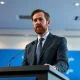 Ripple CEO Brad Garlinghouse speaking at a press event about XRP and blockchain regulation.