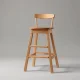 A wooden children's tower stool isolated on a neutral background, subject of a nationwide recall.