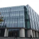Czech National Bank building in Prague under overcast sky
