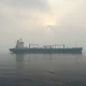 Oil tanker near Strait of Hormuz under cloudy morning sky