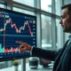 Financial analyst reviewing Bitcoin, Ethereum, and XRP price charts on a large screen in a modern office