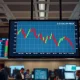 Dollar index chart showing decline on trading floor amid market volatility