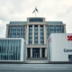 European Central Bank building in Frankfurt with bank facades representing UniCredit and Commerzbank in foreground