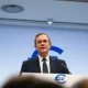 ECB Chief Economist Philip Lane speaking at a press conference, warning about oil shock and rate hikes.