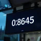 EUR/GBP exchange rate displayed on a trading screen at 0.8645, with UK Parliament in background