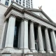 Federal Reserve Bank of New York building exterior on a cloudy day in Manhattan