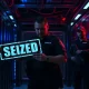 Law enforcement officers in a server room during a cybercrime takedown operation