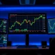 GBP/USD candlestick chart showing upward momentum approaching 1.3700 level on a trading monitor