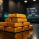 Stack of gold bars on a dark surface with soft lighting, representing gold price stability amid inflation and geopolitical events.