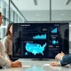 Fintech team reviewing loan growth data and US expansion map in modern London office