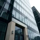 Exterior of a modern corporate office building in London, representing Jusan's UK operations