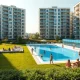 Vienna's Alterlaa social housing complex with pool and green areas on a sunny day
