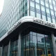 Exterior of the Lloyd's of London building on a cloudy day in the City of London.