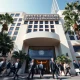 Financiers and business leaders entering the Beverly Hilton for the Milken Institute Global Conference